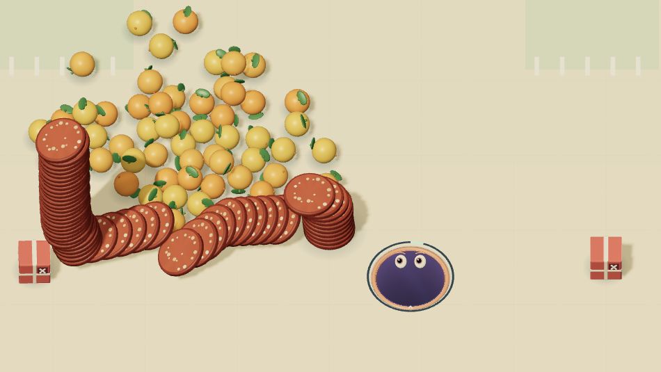 Actual Ravage Devour gameplay: Maw beside a toppled pepperoni tower and a scattered fruit pyramid.
